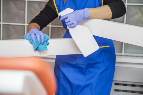 Trained carpet cleaner using protective measures during a cleaning job